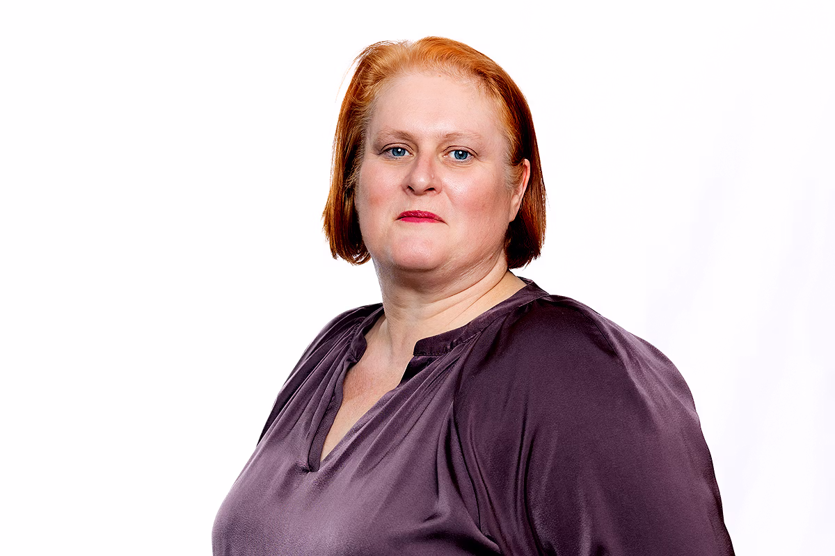 Corporate headshot photographer capturing a polished professional portrait for company profiles