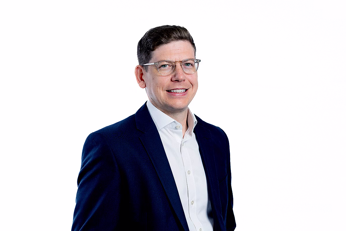 Corporate headshot photographer producing a polished portrait for LinkedIn and corporate websites