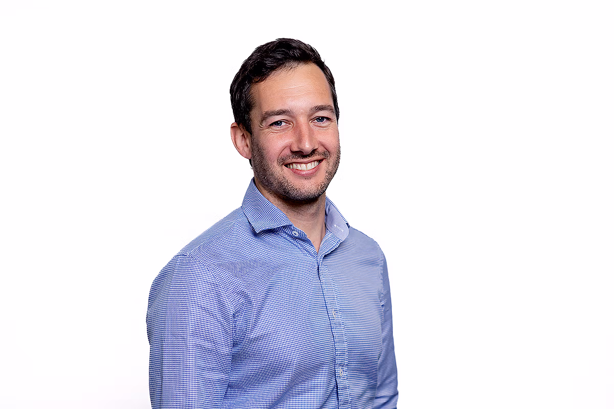 Corporate headshot photographer creating a natural executive portrait for leadership profiles